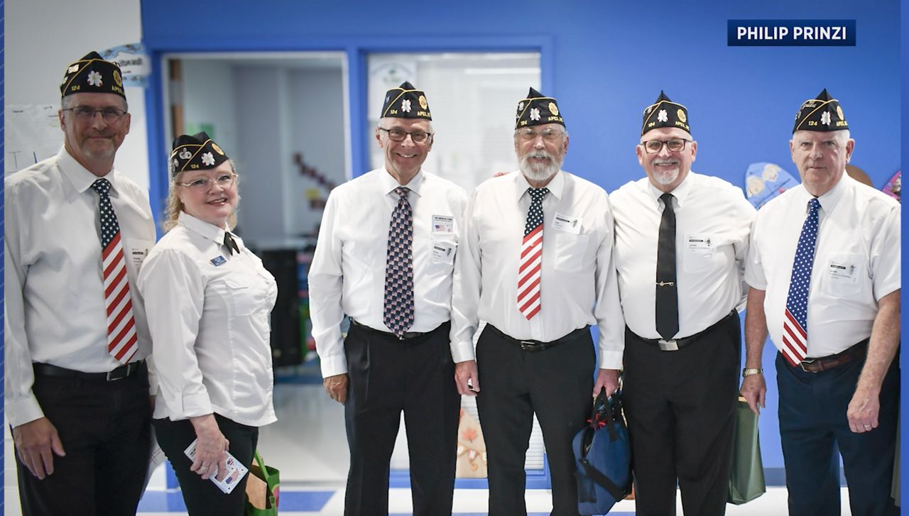 Veterans pose for a picture at Baucom Elementary School.