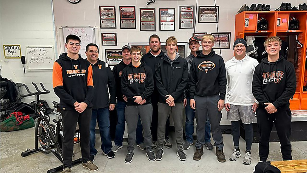 Versailles HS football players and dads share unique bond