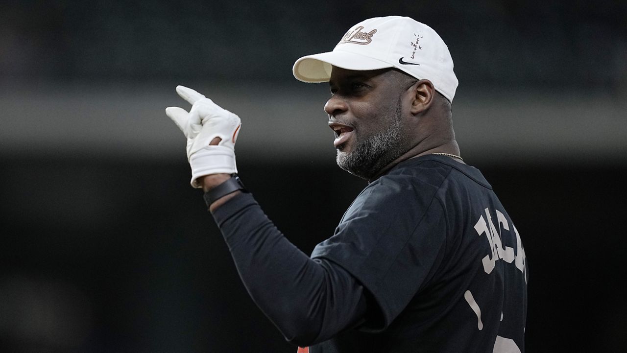 Vince Young after reaching base during the Cactus Jack Foundation HBCU Celebrity Softball Classic, Thursday, Feb. 16, 2023, in Houston. (AP Photo/Kevin M. Cox)