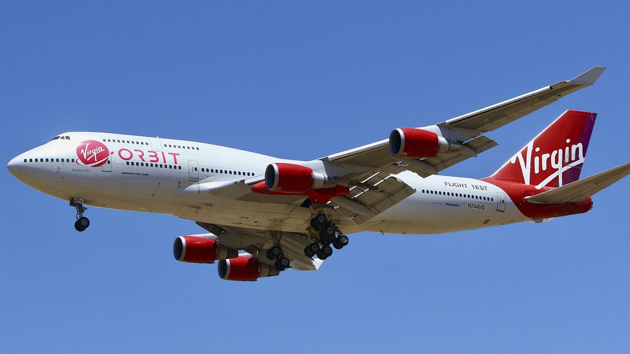 A Virgin Orbit Boeing 747-400 aircraft named Cosmic Girl prepares to land back at Mojave Air and Space Port in the desert north of Los Angeles on May 25, 2020. (AP Photo/Matt Hartman)