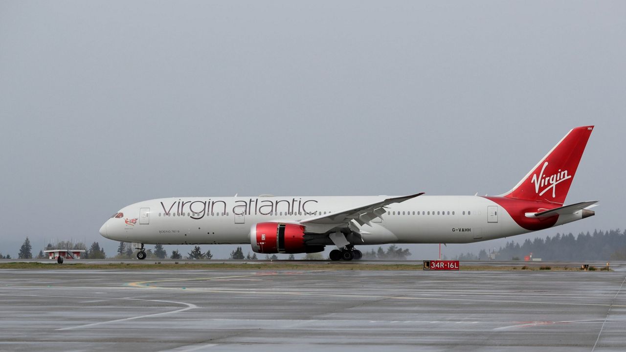 A Virgin Atlantic Airways plane taxis Friday, April 13, 2018, at the Seattle-Tacoma International Airport in Seattle.  (AP Photo/Ted S. Warren)