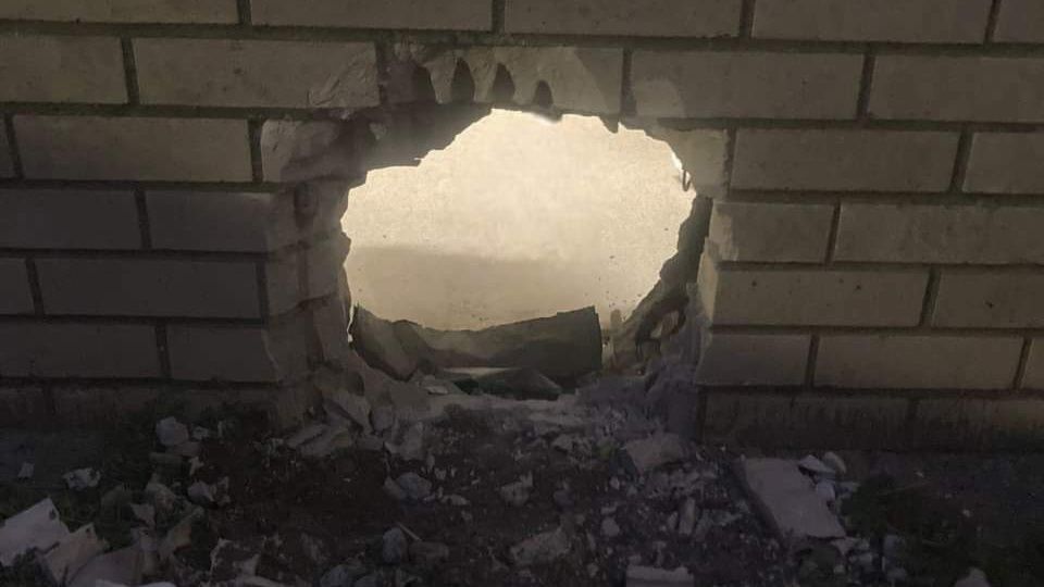 This photo provided by Newport News Sheriff's Office shows a hole in the wall of a prison cell in Newport News, Va., on March 20, 2023. (Newport News Sheriff's Office via AP)