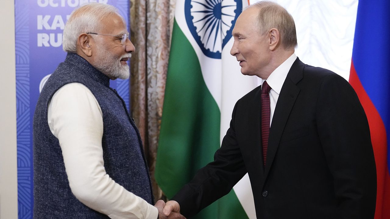 Russian President Vladimir Putin, right, and Indian Prime Minister Narendra Modi shake hands during their meeting on the sidelines of BRICS Summit at Kazan Kremlin in Kazan, Russia, Tuesday, Oct. 22, 2024. (AP Photo/Alexander Zemlianichenko, Pool)