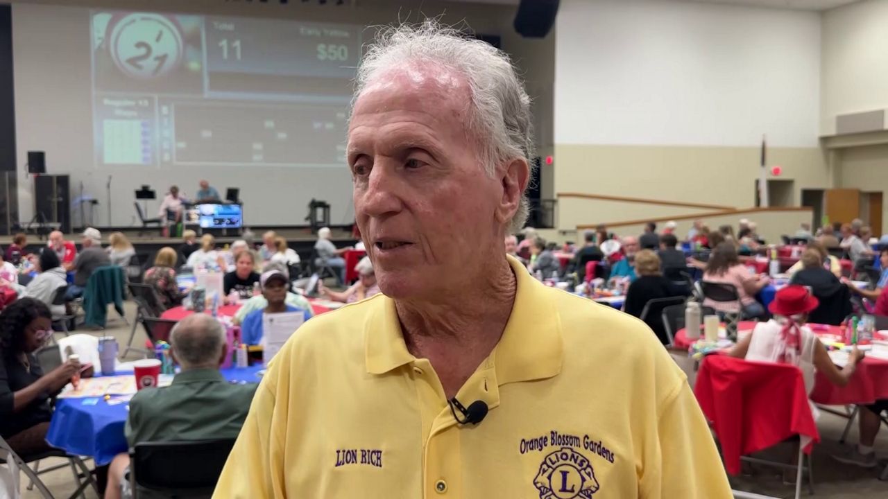 Volunteers work golf course, bingo game for scholarships