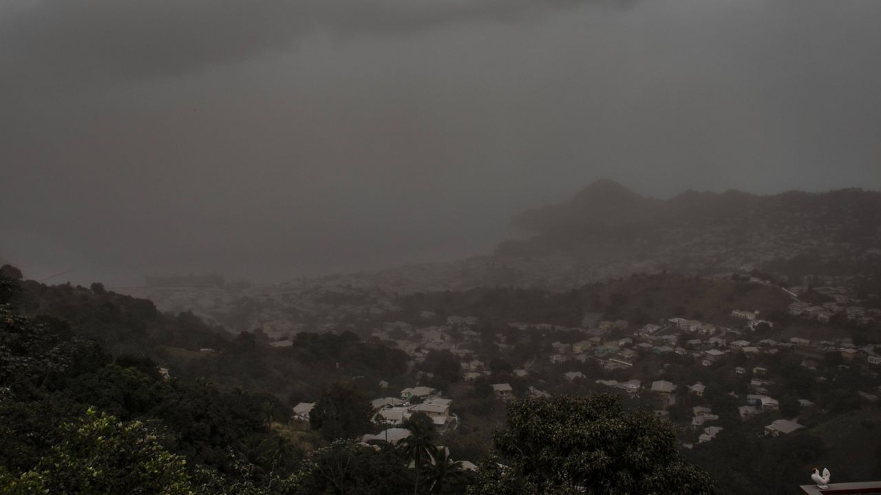 A cloud of volcanic ash hovers over Kingstown, St. Vincent, on Saturday after the La Soufriere volcano erupted. (AP Photo/Lucanus Ollivierre)