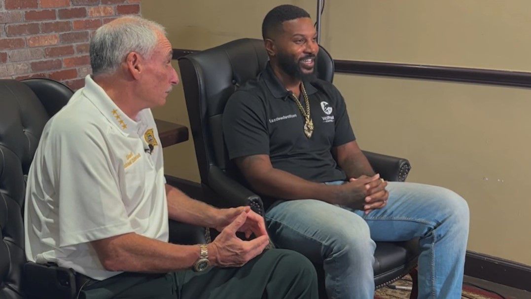 Volusia County Sheriff Mike Chitwood (left) sits next to Joseph Griffin, who was told he fit the description of a burglary suspect. The way it was handled continues to be a training tool. (Spectrum News)