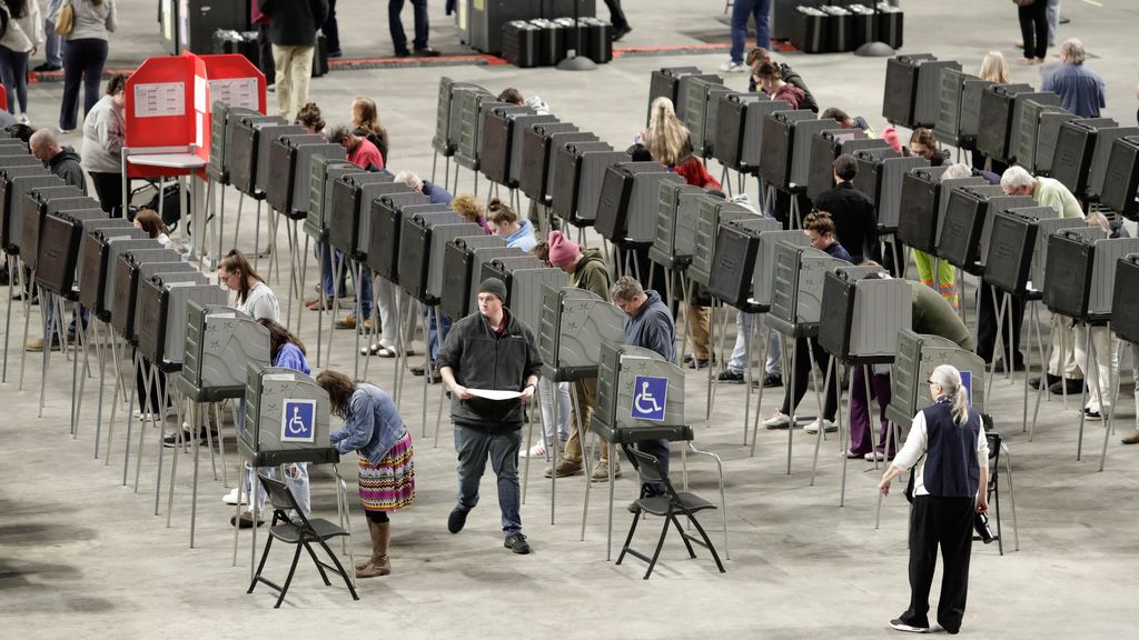 Voters fill out their ballots on Election Day Tuesday, Nov. 5, 2024, at the Cross Insurance Center in Bangor, Maine. (AP Photo/Joel Page)