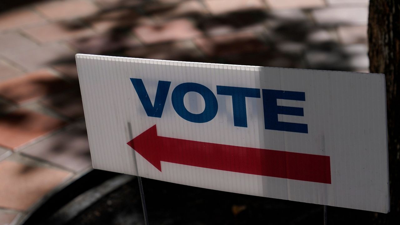 A sign outside of an early voting location in Miami is pictured on Monday, Oct. 31, 2022.