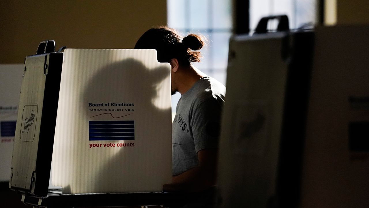 A person votes during Election Day, Tuesday, Nov. 7, 2023, at Knox Presbyterian Church in Cincinnati. (AP Photo/Joshua A. Bickel)