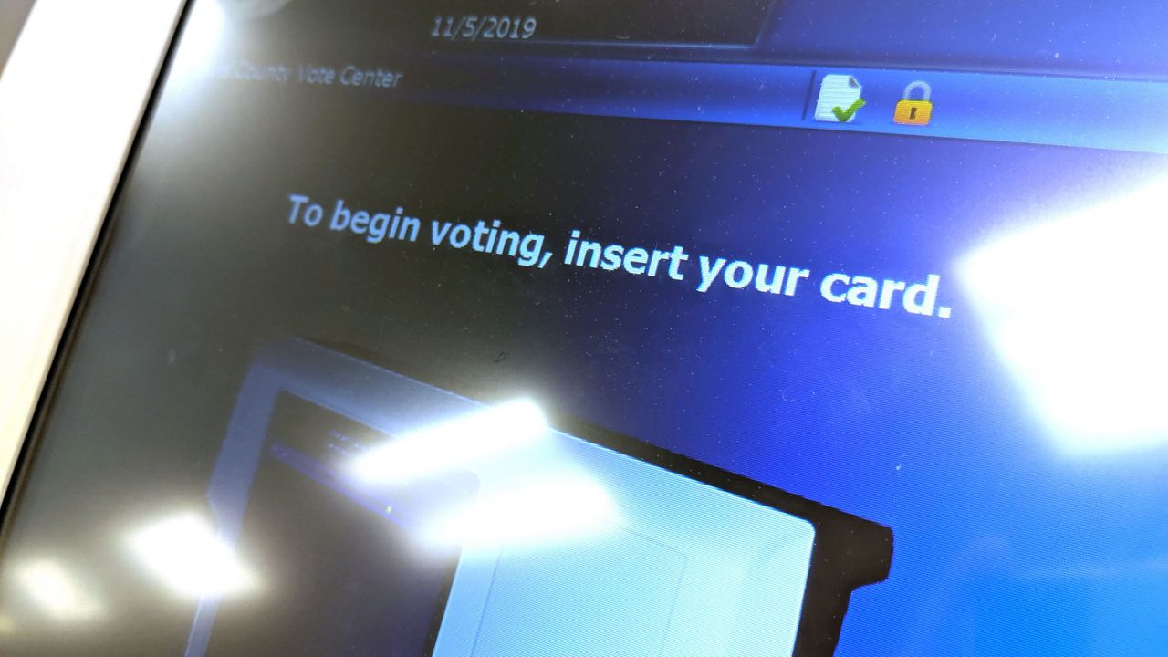 Travis County voting screen with the text, "To being voting, insert your card." (Spectrum News)