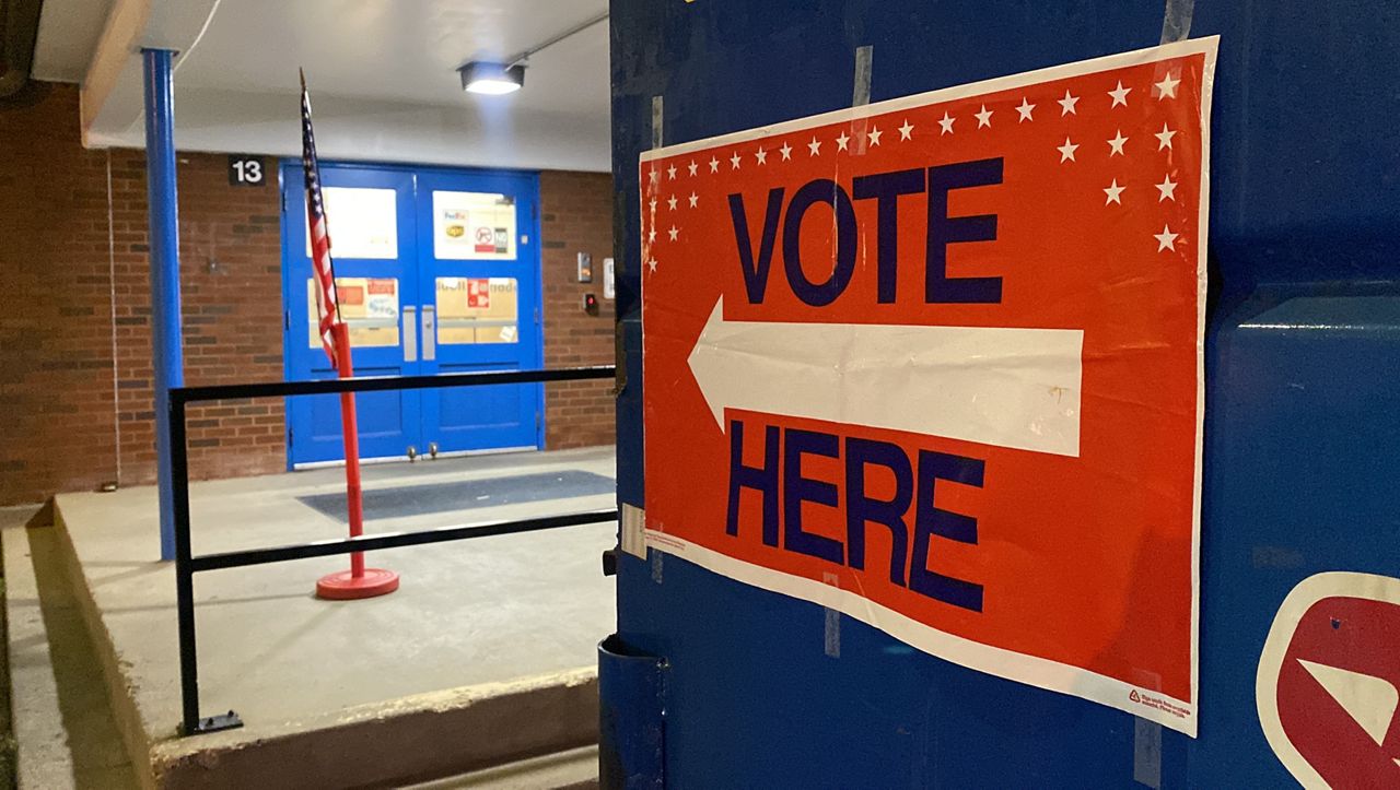 A voting sign greets voters at Jefferson County Traditional Middle School which is a polling place in Louisville. (Spectrum News 1/Diamond Palmer)