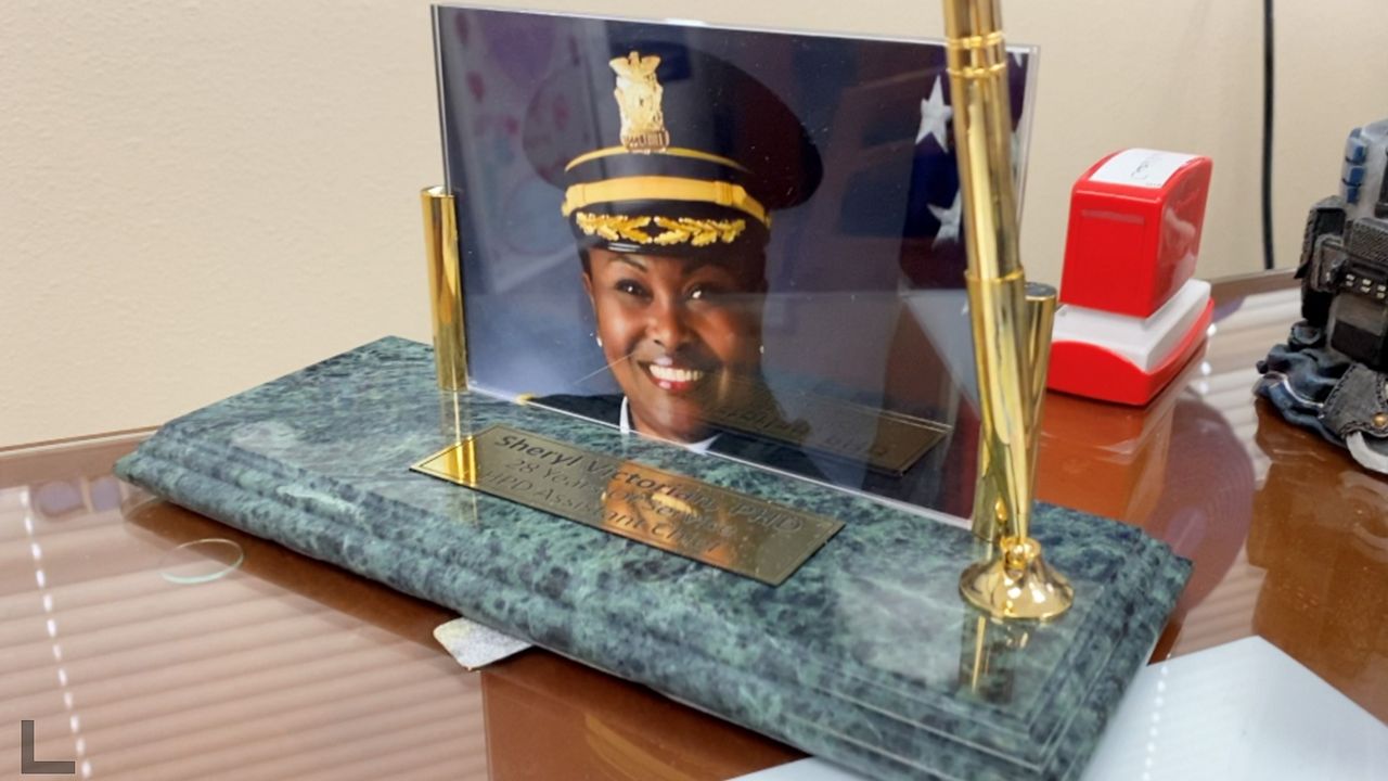A photo of Chief Sheryl Victorian on her desk. (Spectrum News 1/Bria Bell)
