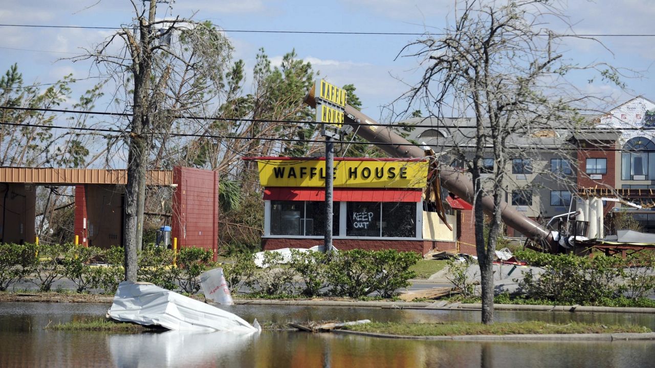 A billboard lies atop a Waffle House restaurant after being knocked down by Hurricane Michael in Panama City, Fla., Oct. 14, 2018. (Carlos R. Munoz/Sarasota Herald-Tribune via AP, File)