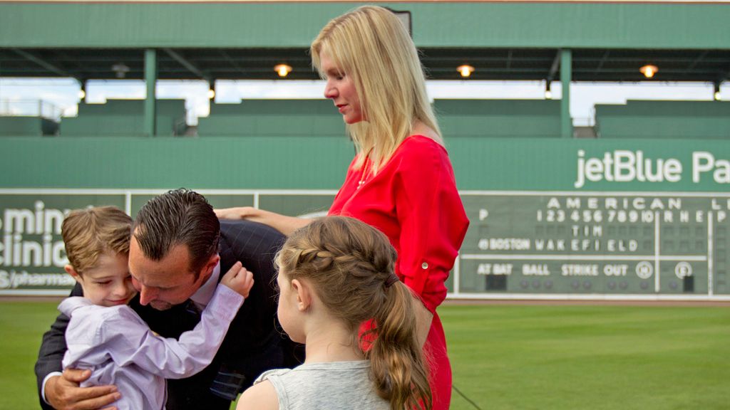 FILE - Boston Red Sox pitcher Tim Wakefield, center left, hugs his son, Trevor, 7, as his wife, Stacy, right, and daughter, Brianna, 6, look on after Wakefield announced his retirement from baseball during a news conference, Friday, Feb. 17, 2012, in Fort Myers, Fla. Stacy Wakefield, the widow of former Boston Red Sox pitcher and two-time World Series champion Tim Wakefield, has died. Wakefield's family said in a statement released through the Red Sox that she died Wednesday, Feb. 28, 2024 at her Massachusetts home, less than five months after her husband died at the age of 57.  (AP Photo/David Goldman, File)