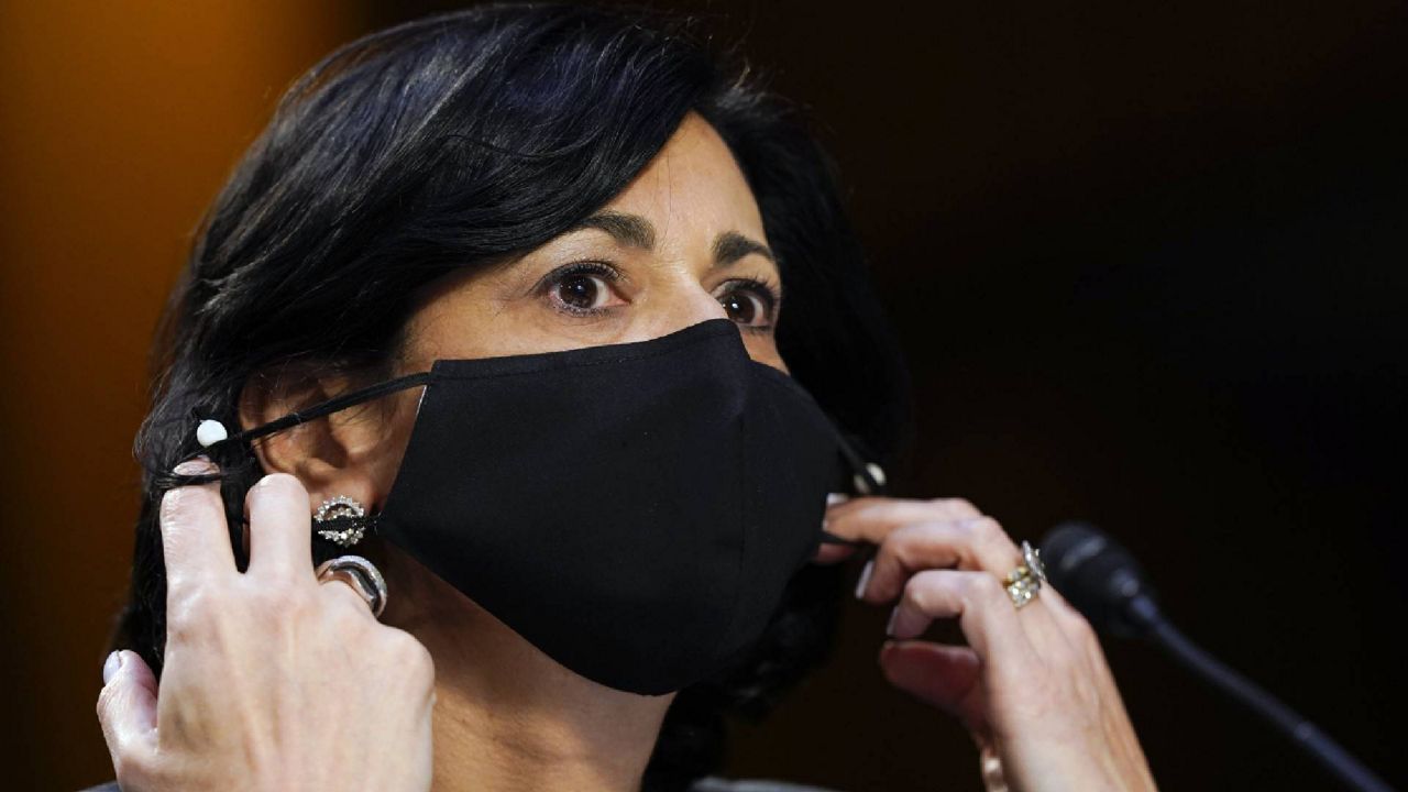 Dr. Rochelle Walensky, director of the Centers for Disease Control and Prevention, adjusts her face mask during a Senate Health, Education, Labor and Pensions Committee hearing on the federal coronavirus response on Capitol Hill in Washington, Thursday, March 18, 2021. (AP Photo/Susan Walsh, Pool)