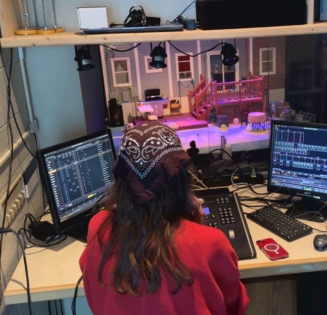 Walker Hansen, a rising senior at Davidson College, works in the lighting booth for a production of "Fat Ham." (Spectrum News 1/Sydney McCoy)