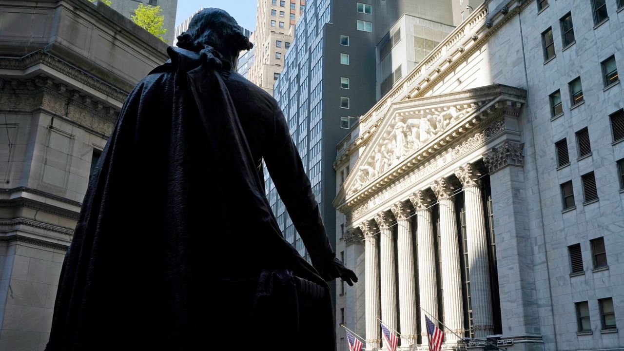 The Federal Hall statue of George Washington overlooks the New York Stock Exchange on June 7. (AP Photo/Richard Drew, File)