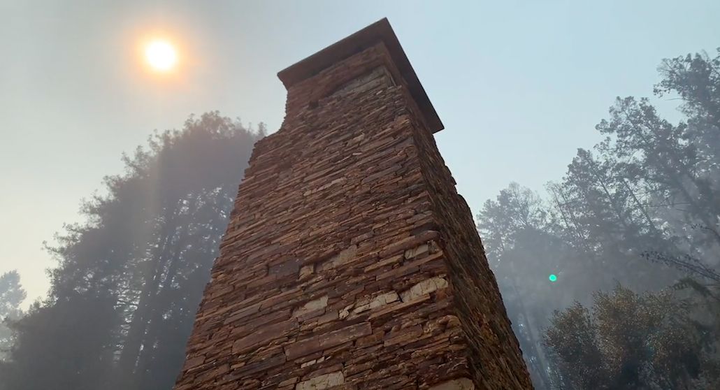 Only the fireplace from Wallace J. Nichols' home is left standing among the redwoods. 