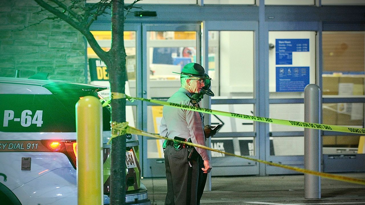 Police respond to the scene of a shooting on Monday, Nov. 20, 2023 in Beavercreek, Ohio.  Police say a shooter opened fire at a Walmart, wounding four people before apparently killing himself. The attack took place Monday night at a Walmart in Beavercreek, in the Dayton metropolitan area. (Marshall Gorby/Dayton Daily News via AP)