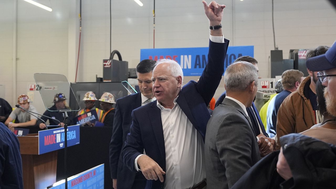 Democratic vice presidential nominee Minnesota Gov. Tim Walz greets supporters after speaking at a campaign event, Friday, Oct. 11, 2024, in Warren, Mich. (AP Photo/Carlos Osorio)