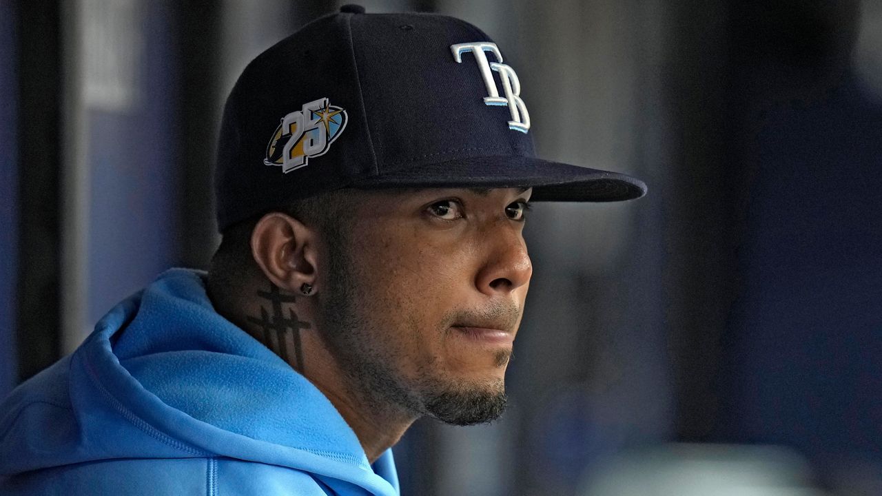 Tampa Bay Rays' Wander Franco watches from the dugout during the fifth inning of a baseball game against the Cleveland Guardians Sunday, Aug. 13, 2023, in St. Petersburg, Fla. (AP Photo/Chris O'Meara)
