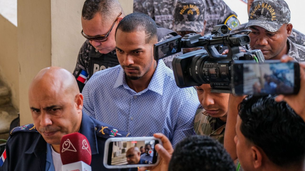 Tampa Bay Rays shortstop Wander Franco (center) is escorted to court by police in Puerto Plata, Dominican Republic on Friday, Jan. 5, 2024. (AP Photo/Ricardo Hernández, File)