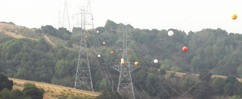 The meaning behind those colorful balls on power lines