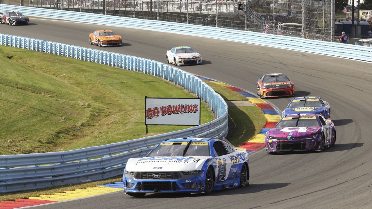 Chase Briscoe (14) drives through the esses during a NASCAR Cup Series auto race, Sunday, Sept. 15, 2024, in Watkins Glen, N.Y. (AP Photo/Lauren Petracca)