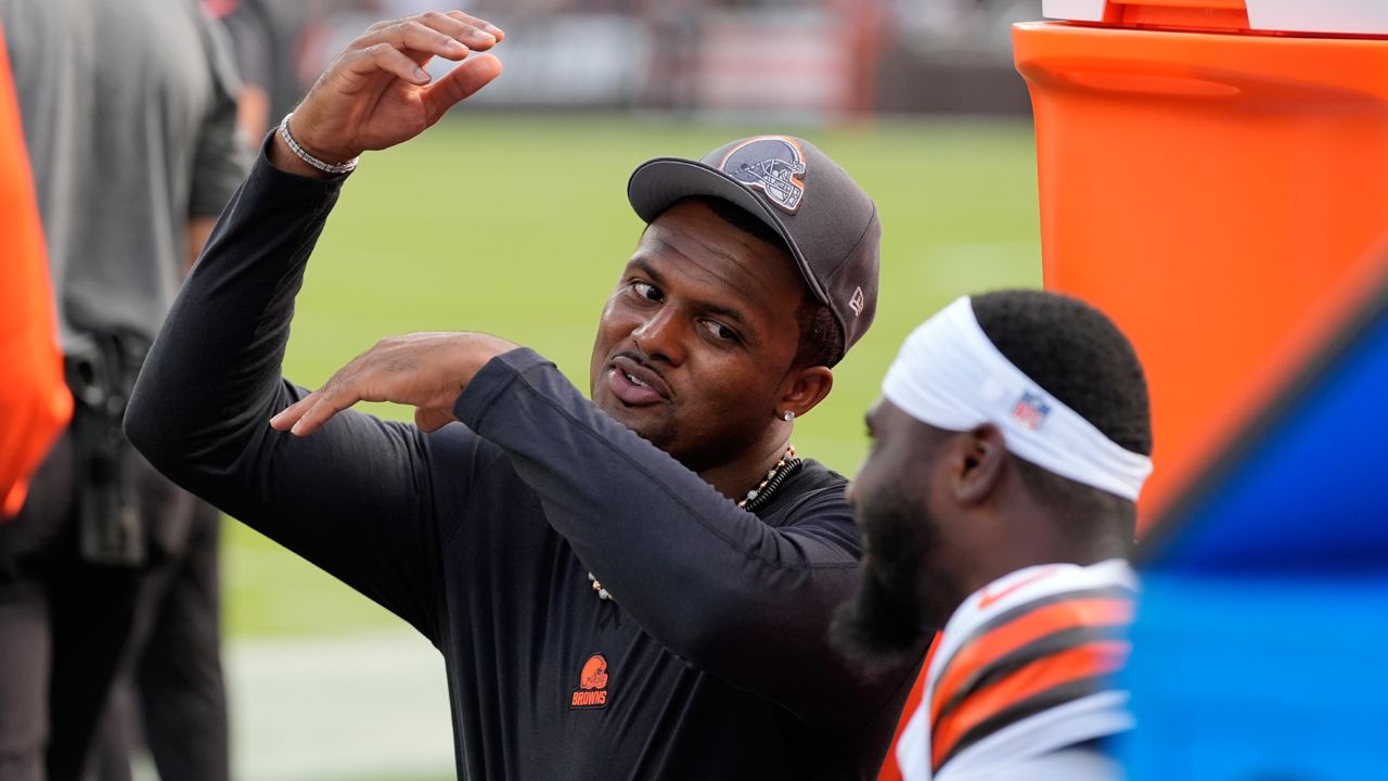 Cleveland Browns quarterback Deshaun Watson talks with teammates on the sidelines during the first half of an NFL preseason football game against the Minnesota Vikings, Saturday, Aug. 17, 2024, in Cleveland.