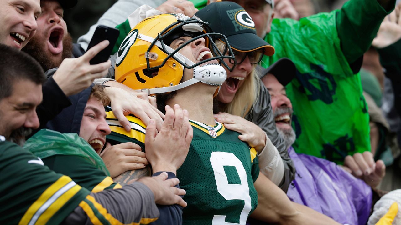 Green Bay Packers wide receiver Christian Watson celebrates his 44-yard reception for a touchdown