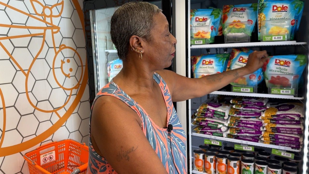 Deyonne Watts says the $200 she currently receives in SNAP benefits is already tight to stretch amongst her five granddaughters, whom she cares for full time. She doesn't know how she will make ends meet without the benefits. (Spectrum News/Nathalie Basha)