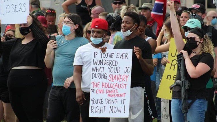 A protester holding a sign. 