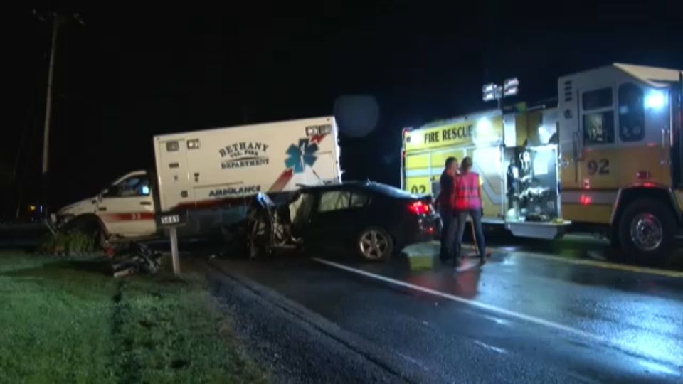 Man dies after crashing into ambulance in Genesee County