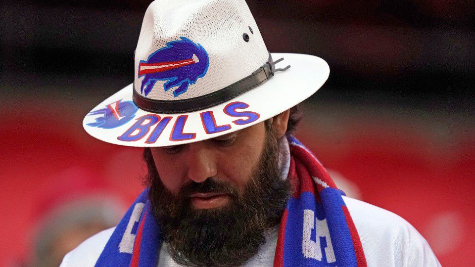 A fan watches players warmup before the AFC championship NFL football game between the Kansas City Chiefs and the Buffalo Bills, Sunday, Jan. 24, 2021, in Kansas City, Mo.