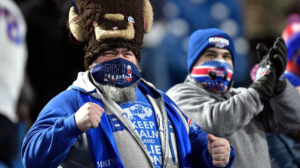 Buffalo Bills fans cheer before an NFL divisional round football game against the Baltimore Ravens Saturday, Jan. 16, 2021, in Orchard Park, N.Y. (AP Photo/Adrian Kraus)