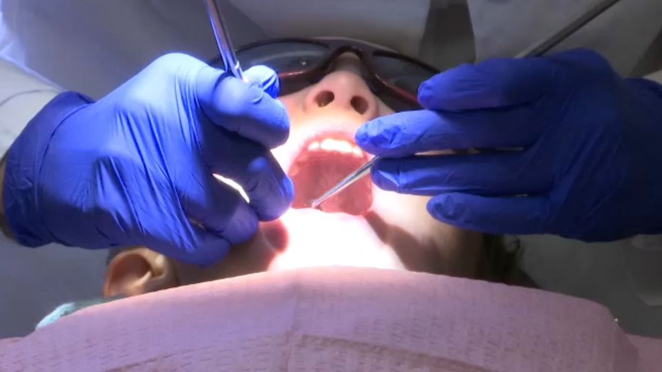 Dentist working on a child's teeth (Spectrum News/File)