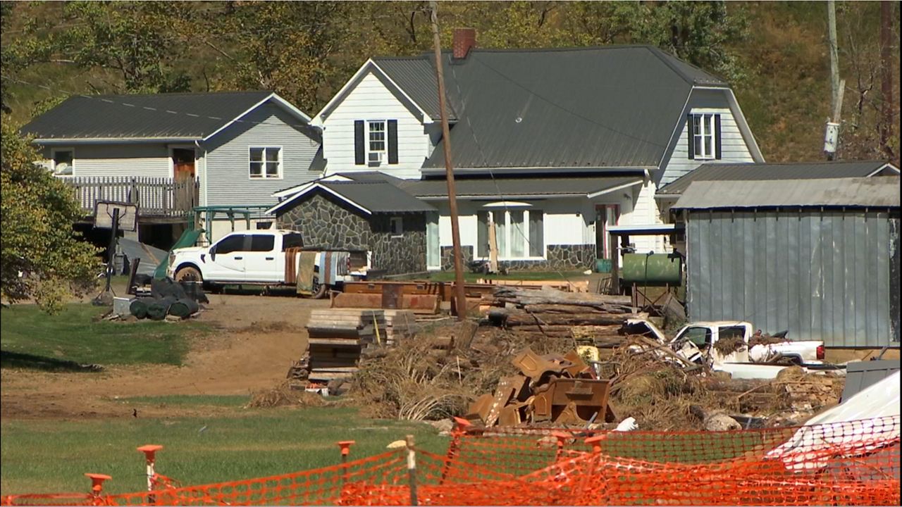 Debris from Hurricane Helene is piled near Micaville Elementary School. (Spectrum News 1/Nick Buffo)