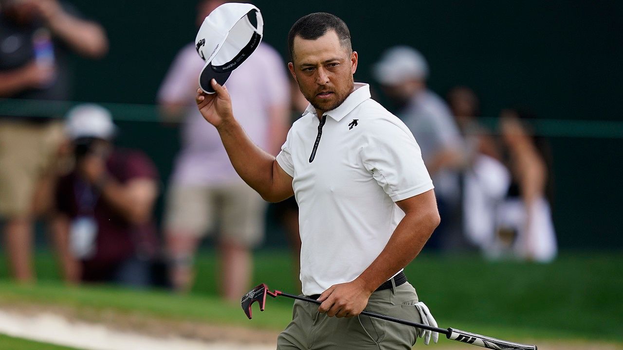 Xander Schauffele waves after completing the second round of the Wells Fargo Championship golf tournament at Quail Hollow on Friday, May 10, 2024, in Charlotte, N.C. (AP Photo/Erik Verduzco)