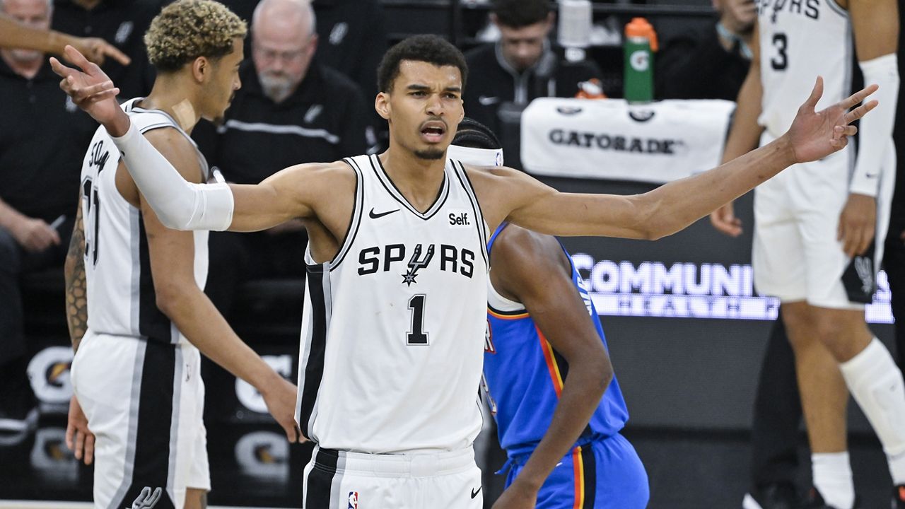 San Antonio Spurs' Victor Wembanyama (1) rallies fans during the second half of an NBA basketball game against the Oklahoma City Thunder, Thursday, Feb. 29, 2024, in San Antonio. (AP Photo/Darren Abate)