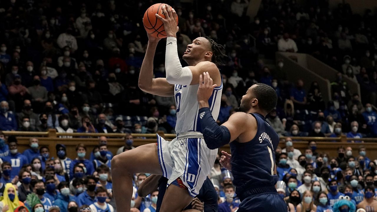 Duke forward Wendell Moore Jr. (0) drives to the basket against Georgia Tech guard Kyle Sturdivant (1) during an NCAA college basketball game in Durham, N.C., Tuesday, Jan. 4, 2022. (AP Photo/Gerry Broome)