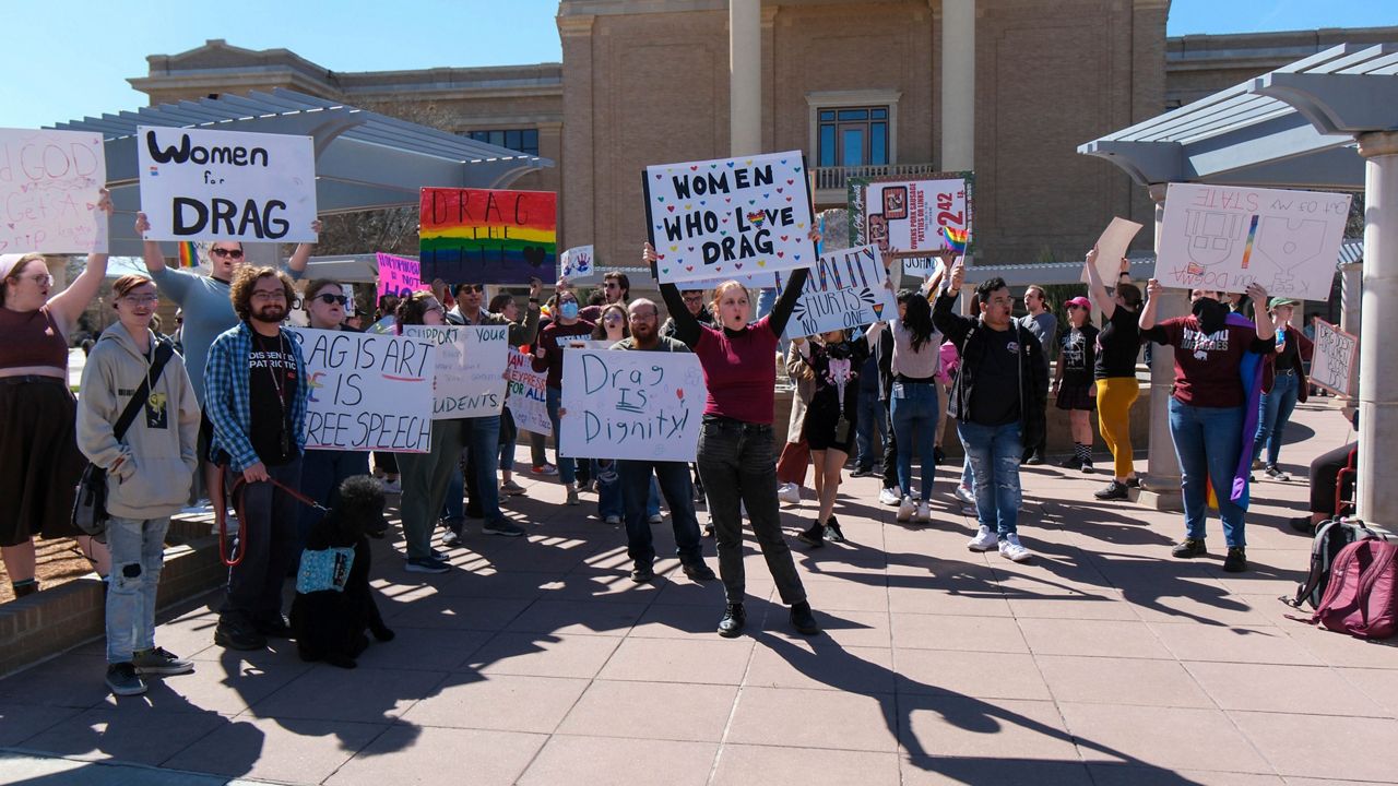 More than 50 people gathered Tuesday, March 21, 2023, at West Texas A&M University in Canyon, Texas, to protest the university president's decision to cancel a drag show on campus. (Michael Cuviello/Amarillo Globe-News via AP)