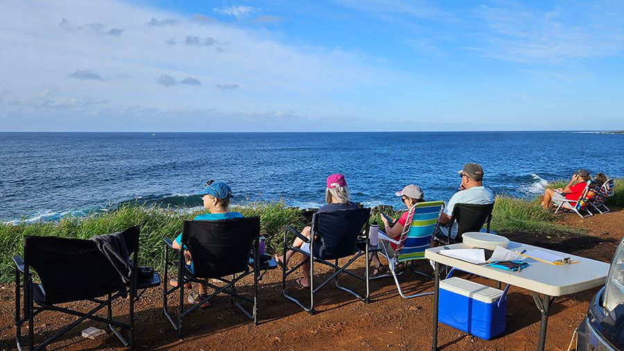 Volunteers set up at Port Allen on Kauai for the Sanctuary Ocean Count. (NOAA/Elizabeth Borchelt)