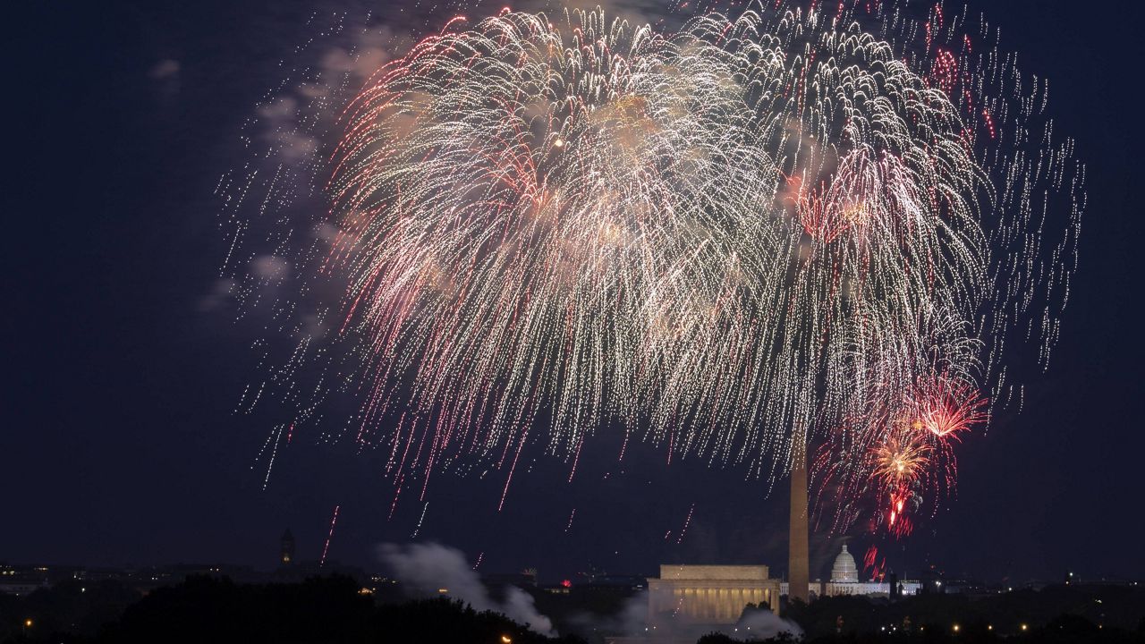 In this July 4, 2020, file photo, fireworks explode over the Lincoln Memorial, the Washington Monument and the U.S. Capitol along the National Mall in Washington. (AP Photo/Cliff Owen, File)