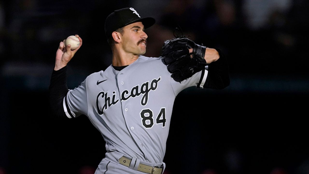 Chicago White Sox starting pitcher Dylan Cease throws to a Texas Rangers batter during the first inning of a baseball game Friday, Aug. 5, 2022, in Arlington, Texas. (AP Photo/Tony Gutierrez)