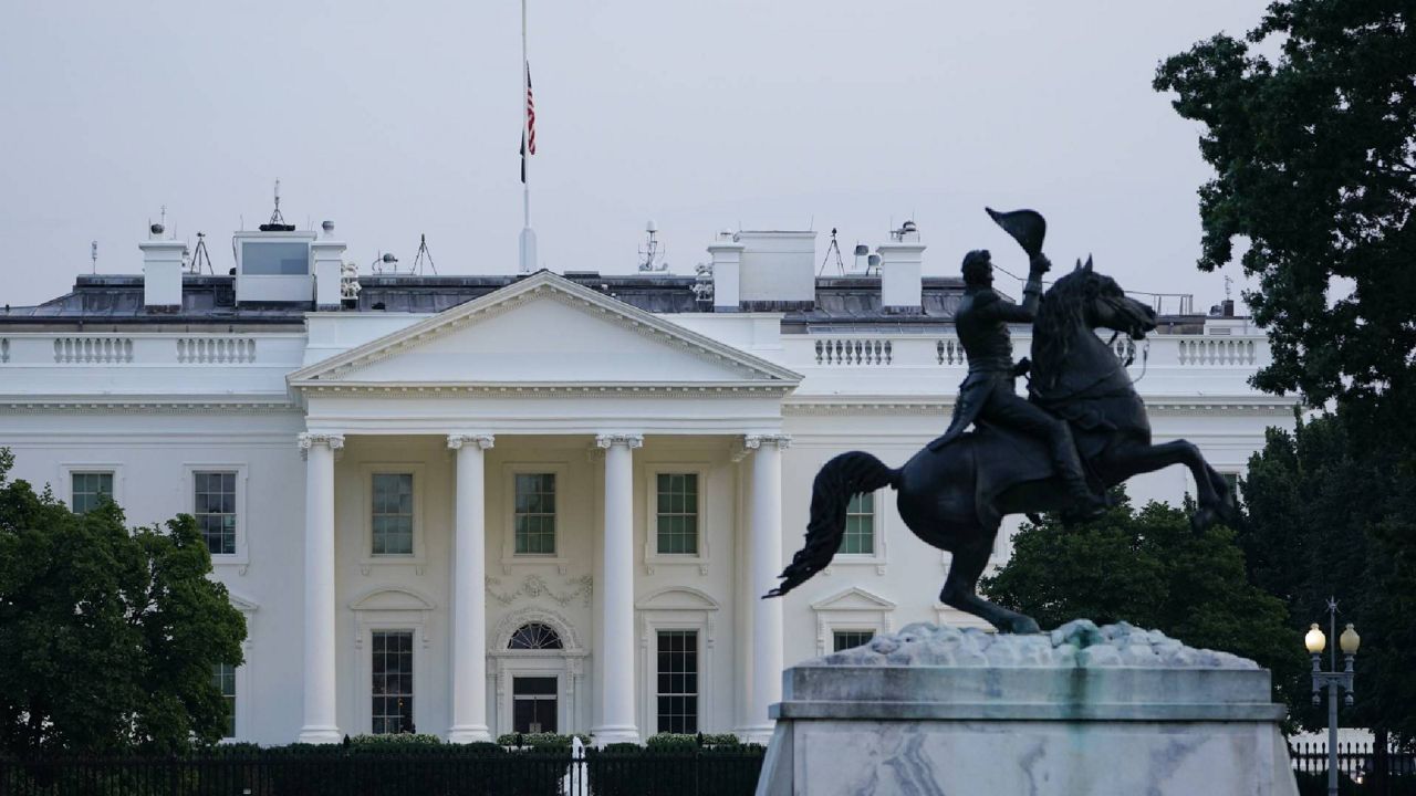 The American flag on the roof of the White House flies at half staff in Washington, Thursday, Aug. 26, 2021, in honor of U.S. service members and other victims killed in the terrorist attack in Kabul, Afghanistan. (AP Photo/Susan Walsh)