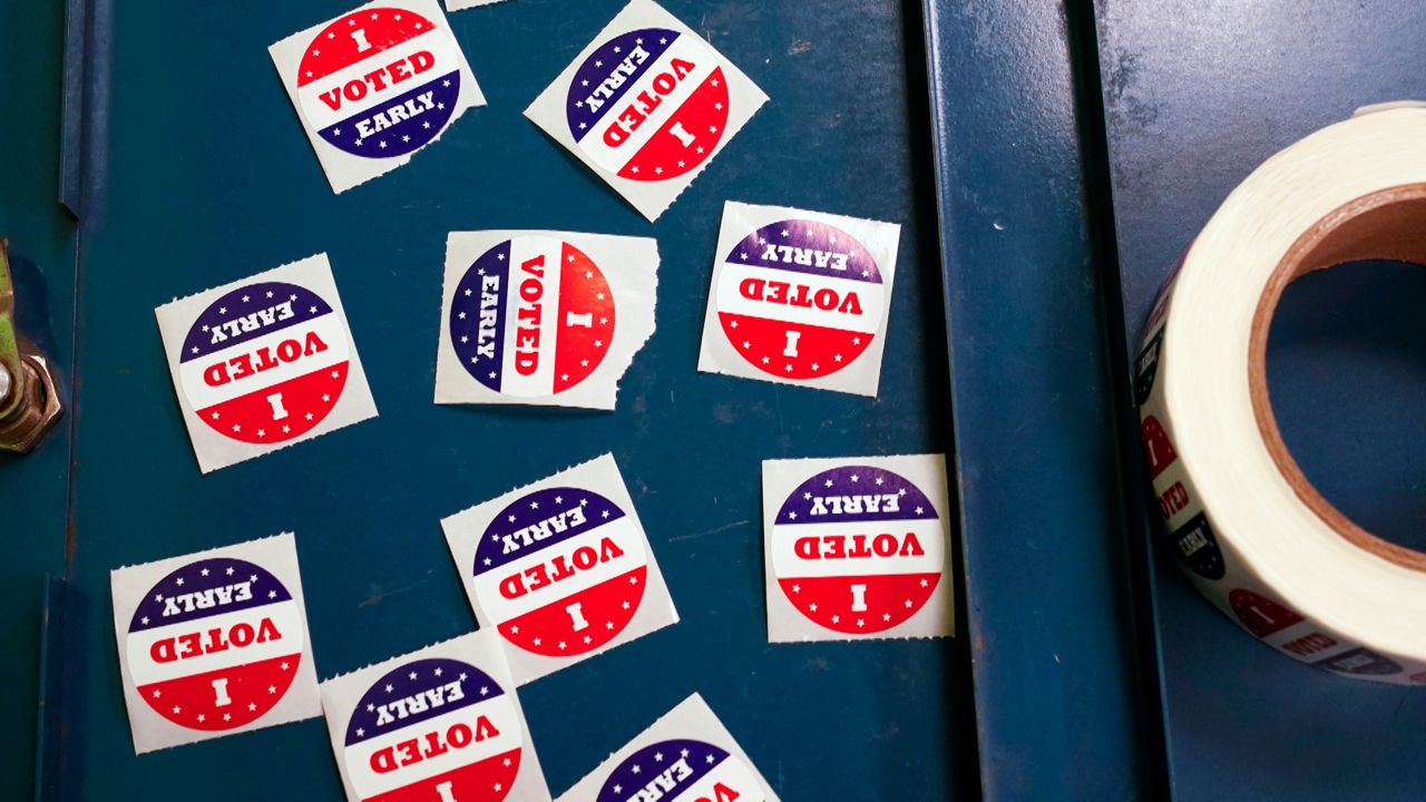 I voted early stickers are seen at a polling station Tuesday, Oct. 25, 2022, in Milwaukee. Tuesday marks the first day to vote early in Wisconsin. (AP Photo/Morry Gash)