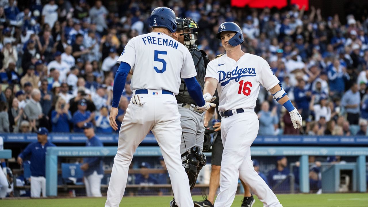 Freeman reaches 100 RBIs and Dodgers beat Rockies 8-2 to near 3rd