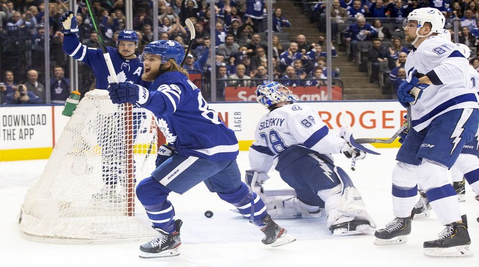 Toronto Maple Leafs right wing William Nylander, front left, celebrates after scoring on Tampa Bay Lightning goaltender Andrei Vasilevskiy, middle, during the first period of an NHL hockey game Tuesday, March 10, 2020, in Toronto. (Chris Young/The Canadian Press via AP)