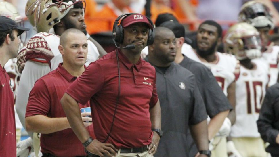 Florida State head coach Willie Taggart looks at the scoreboard late in the fourth quarter of an NCAA college football game against Syracuse in Syracuse, N.Y., Saturday, Sept. 15, 2018. Syracuse won 30-7. (AP Photo/Nick Lisi)