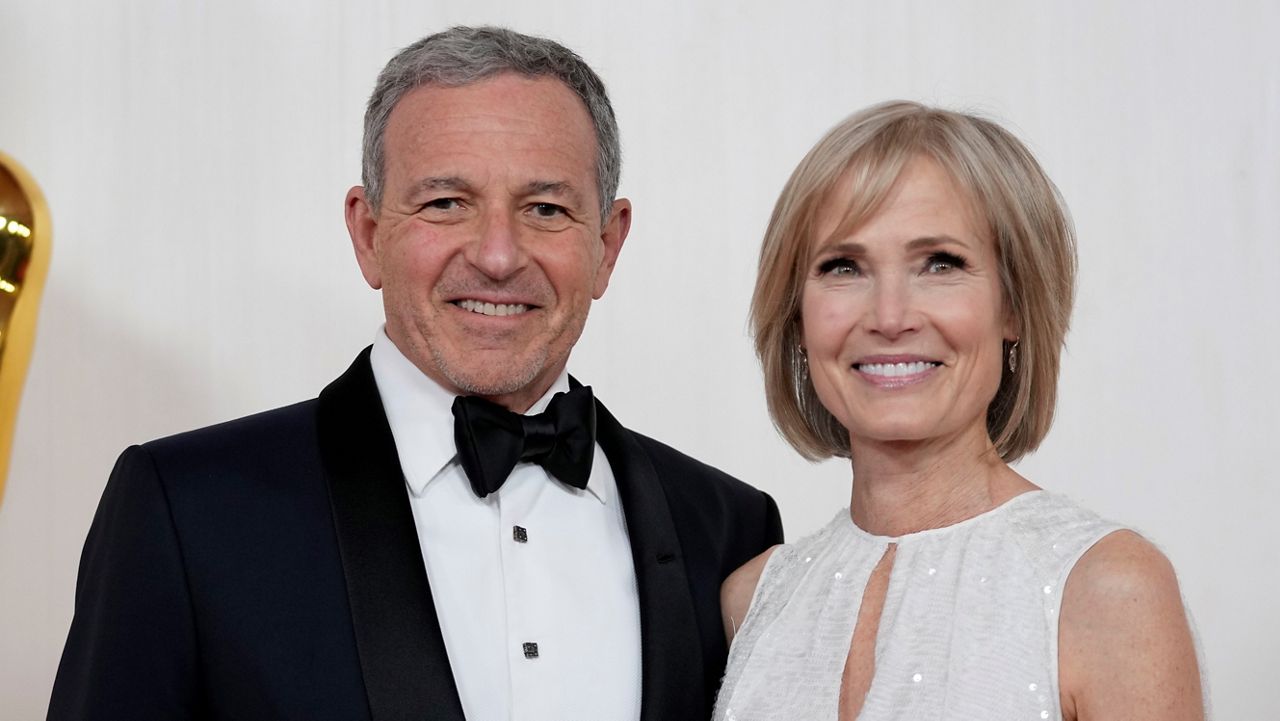 Bob Iger, left, and Willow Bay arrive at the Oscars on March 10, 2024, at the Dolby Theatre in Los Angeles. (AP Photo/Ashley Landis)